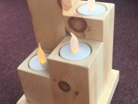 Kerzenständer mit vier Kerzen aus Zirbenholz 